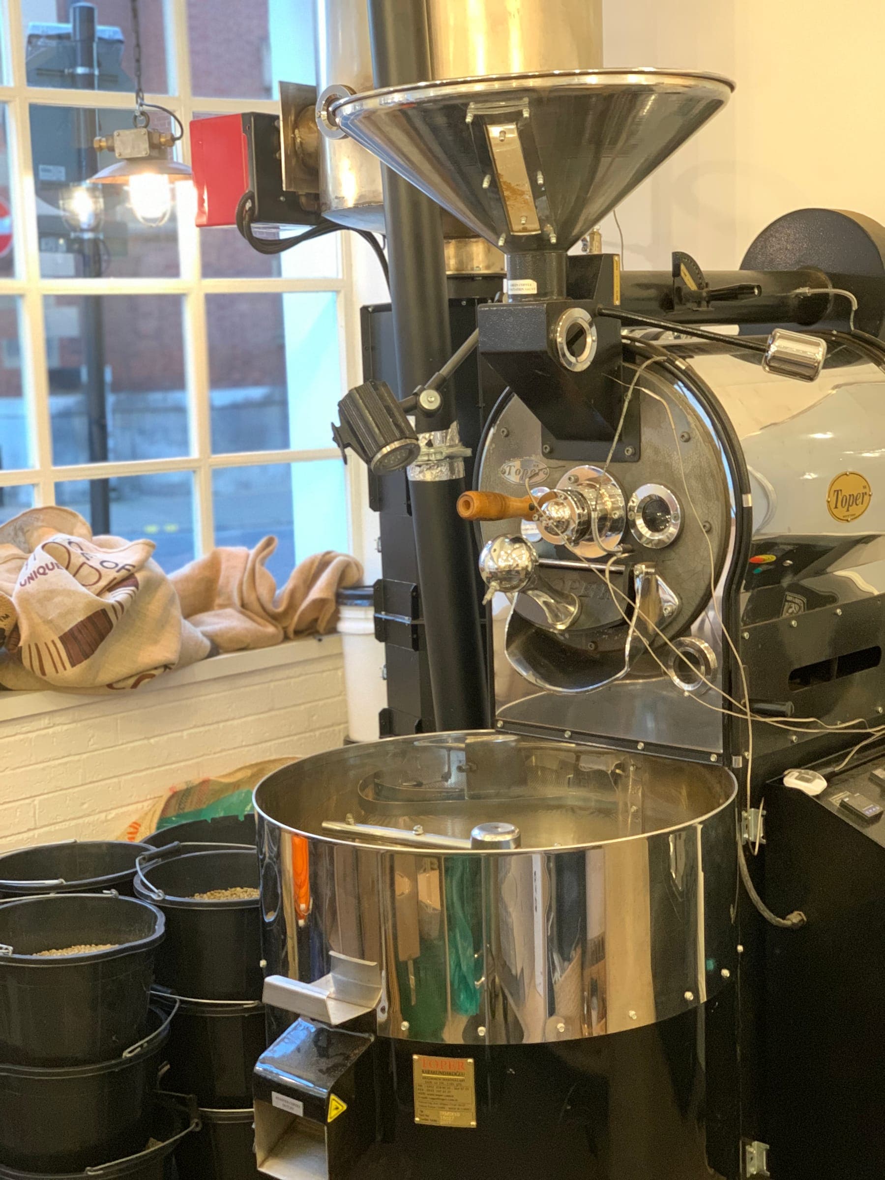 The coffee roaster by the window at The Coffee Counter roastery, Leicester